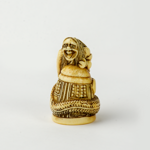 Netsuke - Kiyohime wrapped around the bell of Dojo-ji